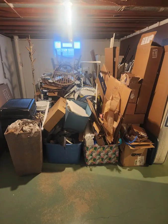 Roll-off dumpster container at job site for Cleanout Dumpster Rental in West Springfield Town