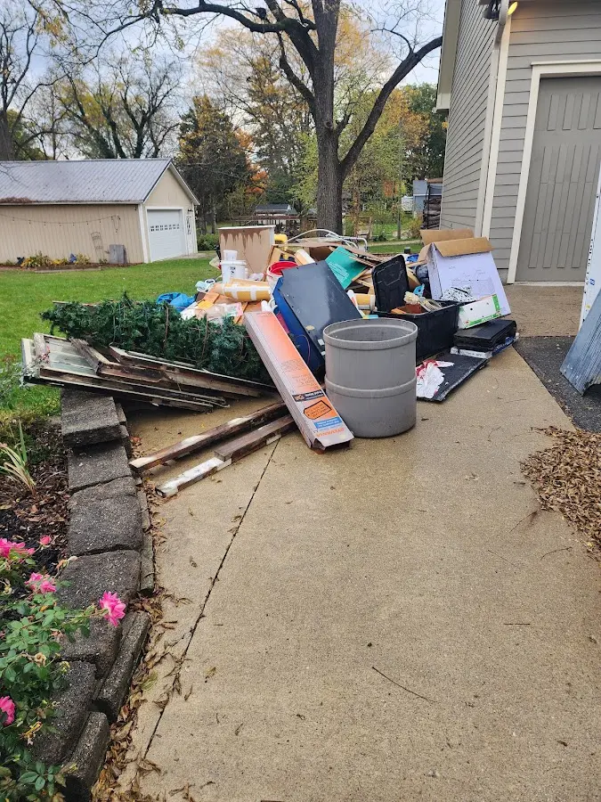 Dumpster being loaded with debris for 3 Yard Dumpster Rental in West Springfield Town